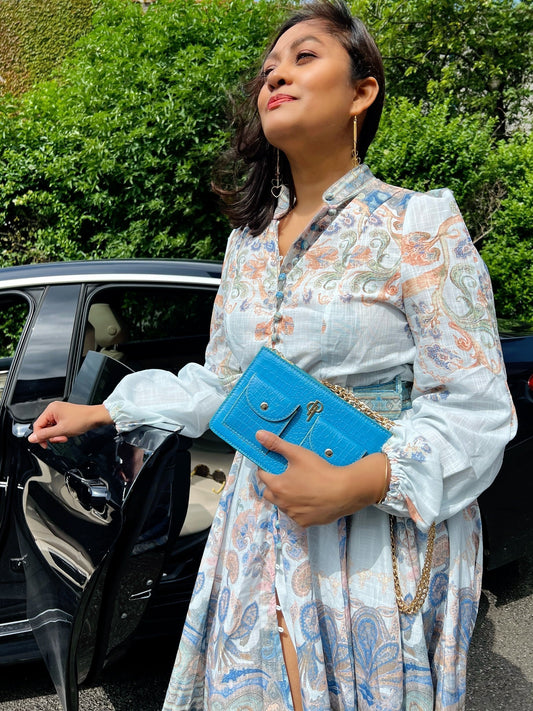 Stylish woman wearing the Amalia Bag by POUCHI – own the moment with timeless design